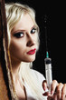 Photo: Sexy young girl in the image of nurse with syringe in hand Sexy young girl in the image of nurse with syringe in hand