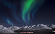 Northern lights, captured above fjords in Norway