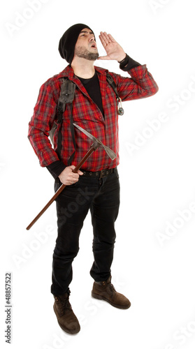 Photo: Adventurer hiker is shouting with backpack and pick Adventurer hiker is shouting with backpack and pick