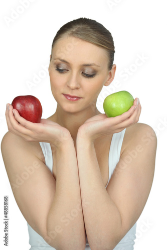 Photo: Woman holding two apples Woman holding two apples