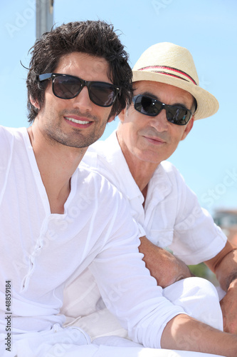 Photo: Grandfather and grandson with sunglasses Grandfather and grandson with sunglasses
