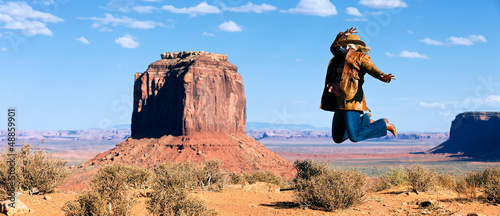 Photo: cowgirl jumping in front of Monument Valley cowgirl jumping in front of Monument Valley