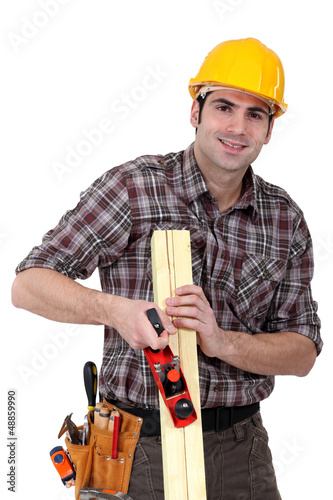 Photo: woodworker working with a rasp woodworker working with a rasp