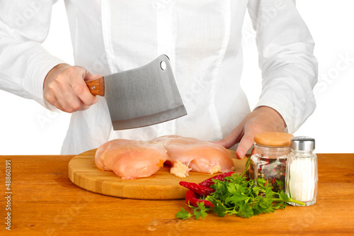 Photo: Chef cooking meat on wooden table Chef cooking meat on wooden table