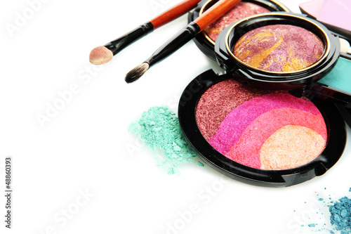 Photo: bright eye shadows and rouge with brushes, isolated on white bright eye shadows and rouge with brushes, isolated on white