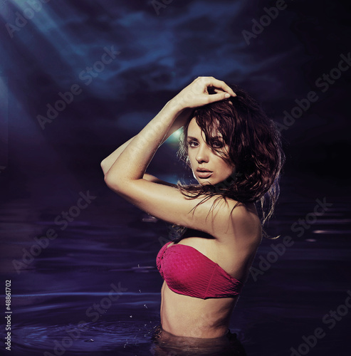 Photo: Alluring brunette girl in the water Alluring brunette girl in the water