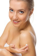 Young girl applying body cream