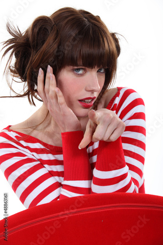 Photo: Fashionable woman pointing her finger Fashionable woman pointing her finger