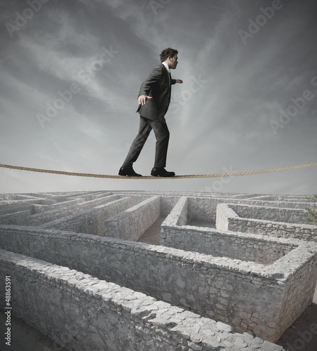 Photo: Businessman bypass the maze Businessman bypass the maze