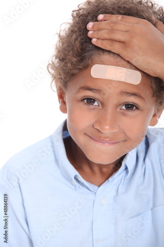 Photo: Little boy with plaster on head Little boy with plaster on head