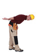 Builder bending over