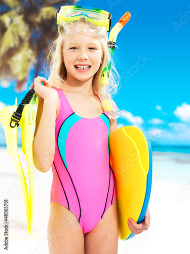 Photo: Happy girl enjoying at beach Happy girl enjoying at beach