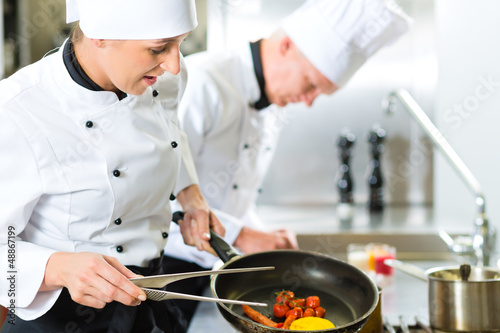 Photo: Two chefs in hotel or restaurant kitchen Two chefs in hotel or restaurant kitchen