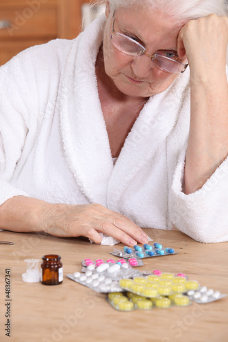 Photo: Elderly woman with medicine Elderly woman with medicine