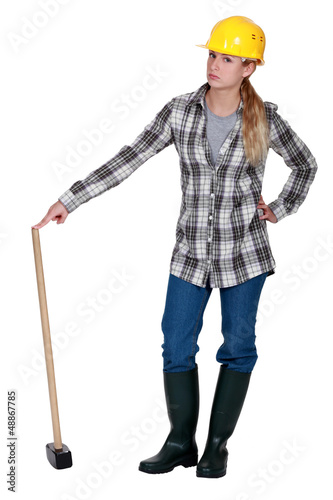 Photo: Construction worker with a sledgehammer Construction worker with a sledgehammer
