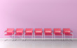 Red stools in the pink waiting room