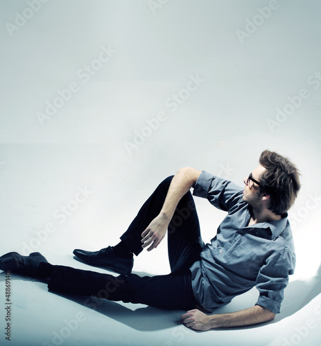 Photo: Sitting and thinking calm man Sitting and thinking calm man