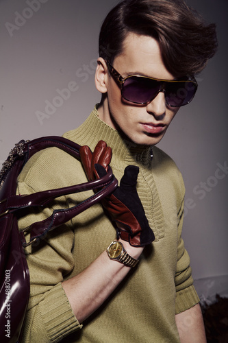 Photo: Fashionable young man with stylish haircut Fashionable young man with stylish haircut