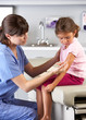Doctor Giving Child Injection In Doctor's Office