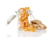 candied ginger in a jar with root