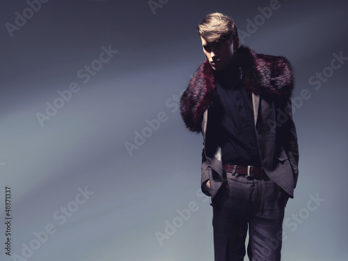 Photo: Charming man showing autumn fashion Charming man showing autumn fashion