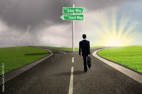 Photo: Businessman choosing easy way Businessman choosing easy way