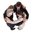 Businesspeople holding hands - teamwork