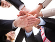 Businesspeople holding hands