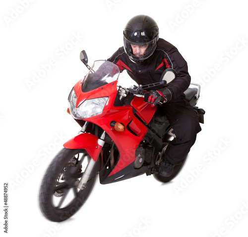 Photo: Man riding a motorbike Man riding a motorbike