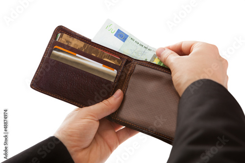 Photo: Man making a cash payment Man making a cash payment
