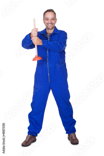 Photo: Happy Plumber Holding Plunger Happy Plumber Holding Plunger