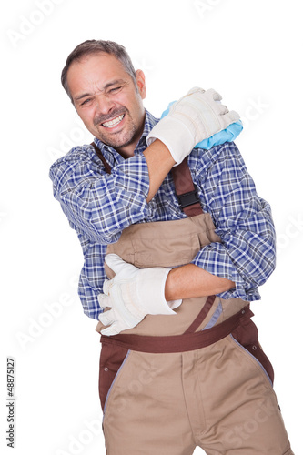Photo: Construction Worker Suffering With Shoulder Pain Construction Worker Suffering With Shoulder Pain