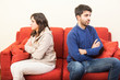 Young Couple on the Sofa after Quarrel