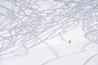 Foto: ski trace and a small figure of freeride skier ski trace and a small figure of freeride skier