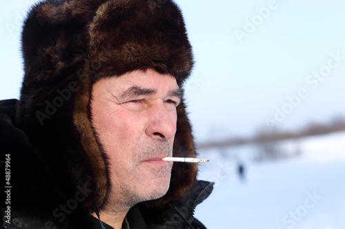 Photo: Man smoking outdoor Man smoking outdoor