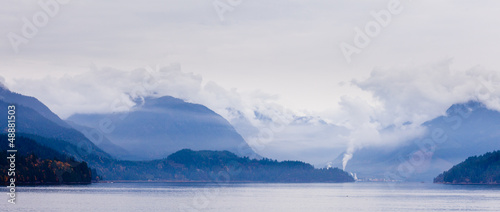 Photo: Rain clouds on coastal mountain ranges BC Canada Rain clouds on coastal mountain ranges BC Canada