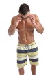Powerful muscular man posing on a white background