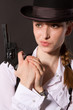 Photo: Portrait of beautiful young woman with a gun. Portrait of beautiful young woman with a gun.