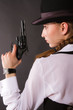 Photo: Portrait of beautiful young woman with a gun. Portrait of beautiful young woman with a gun.
