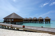 Photo: jetty on tropical island leading to over water villas jetty on tropical island leading to over water villas