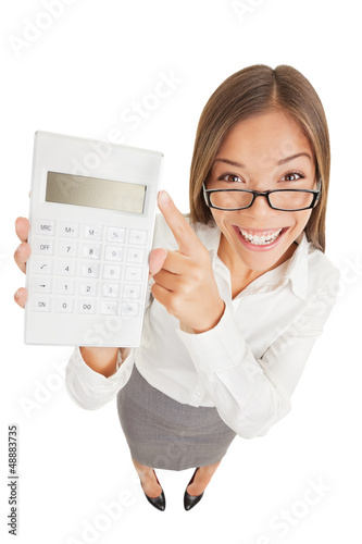 Photo: Accountant gleeful woman pointing to a calculator Accountant gleeful woman pointing to a calculator