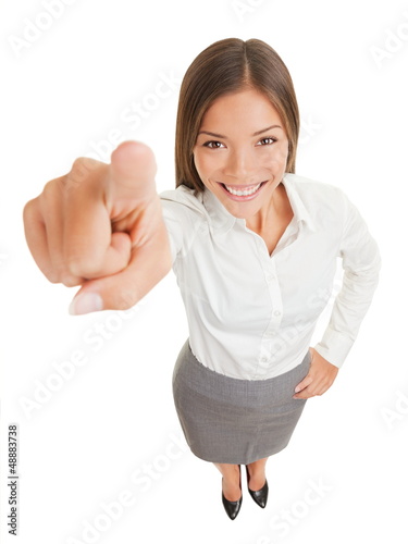Photo: Positive business woman pointing at camera Positive business woman pointing at camera