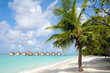 Photo: over water bungalows on tropical white sand beach over water bungalows on tropical white sand beach