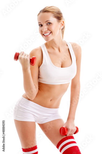 Photo: beautiful woman holding dumbbells beautiful woman holding dumbbells