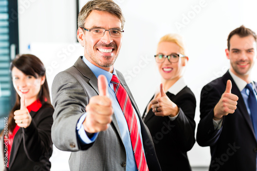 Photo: Business - group of businesspeople in office Business - group of businesspeople in office