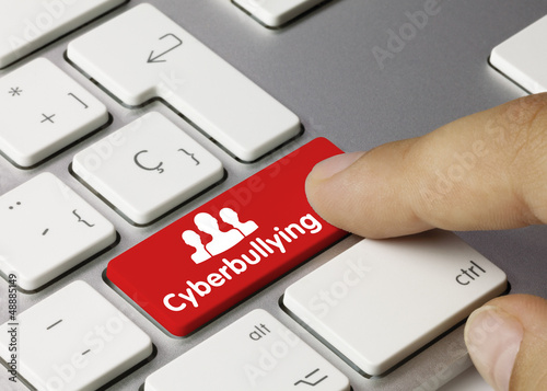 Photo: Cyberbullying keyboard key. Finger Cyberbullying keyboard key. Finger