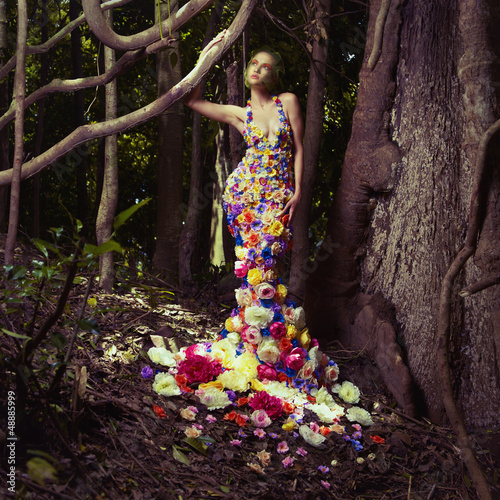 Photo: Beautiful lady in dress of flowers Beautiful lady in dress of flowers