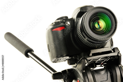 Photo: Single-lens reflex camera on tripod isolated on white Single-lens reflex camera on tripod isolated on white