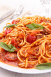 spaghetti with bolognese sauce and basil