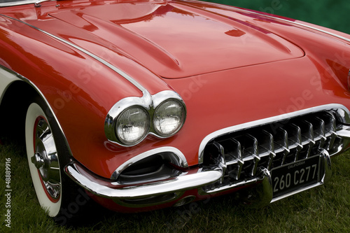 Photo: the hood of a classic sports car the hood of a classic sports car
